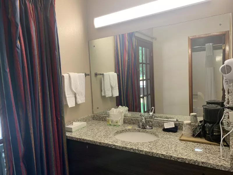 Bathroom of double queen courtside room with balcony