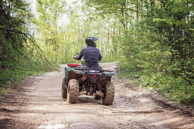 man riding atv in the mountains